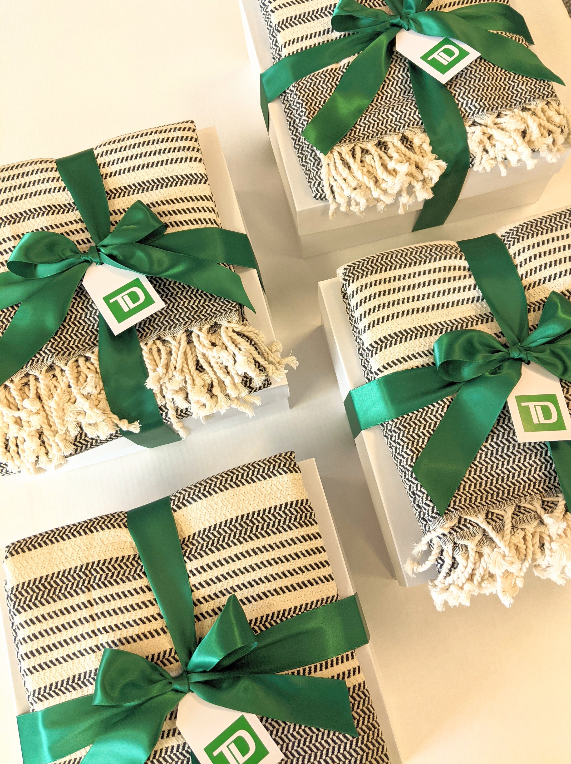 TD corporate event gifts with turkish throw and branded TD gift tags and green ribbon